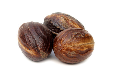 Nutmeg or Jaifal Spice over white backgroundの写真素材