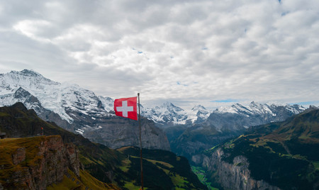 Swiss flag in the alpsの写真素材