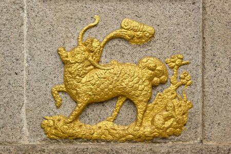 Chinese Unicorn(Qilin) totem on a Chinese Temple wall, Chinese Unicorn is a kid of dragon and phoenix. It is symbolic of healthy, good luck and happiness.の写真素材