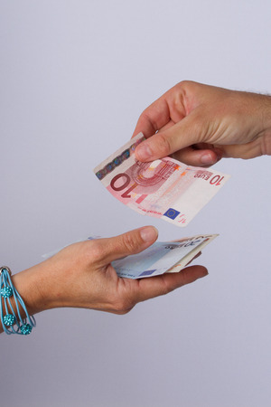 hand giving money concept の写真素材