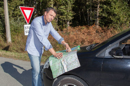 man is reading a map