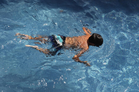 Portrait of boy swimming in a poolの写真素材