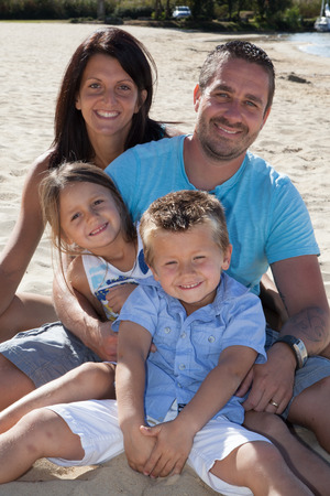 Young Happy Family on the beachの写真素材