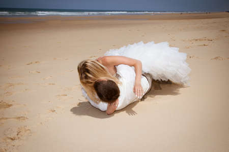 Cute happy couple on the beachの写真素材