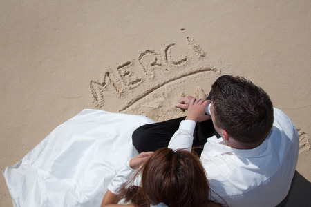 Cute happy couple on the beachの写真素材