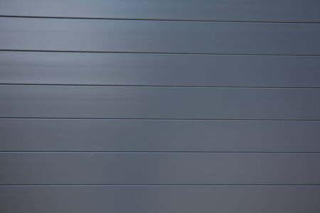 the background of weathered painted wood for designの写真素材