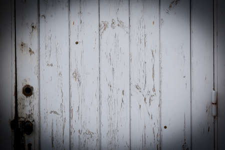 An old white wood in the wall with shadowの写真素材