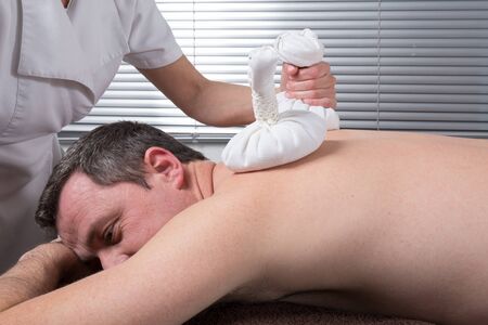 Man having a nice  massage at spa center - close upの写真素材