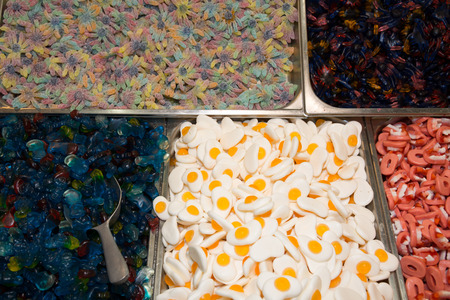 Mixed colorful jelly, gummy candies on background