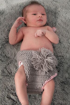 Close up of cute new born baby looking at the cameraの写真素材