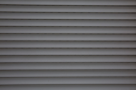 A  dark grey plastic panels texture background