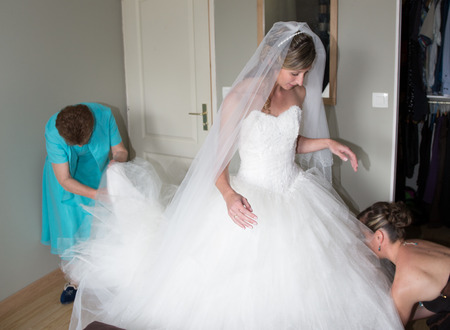 Beautiful caucasian bride getting ready for the wedding ceremonyの写真素材
