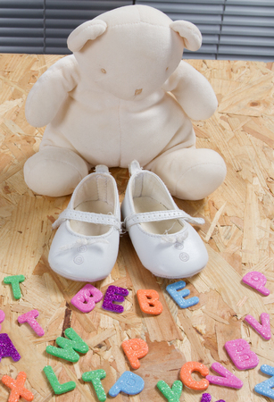 Baby card, concept of new born baby with shoesの写真素材