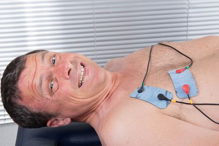 doing massage of electrostimulator Medical procedure.