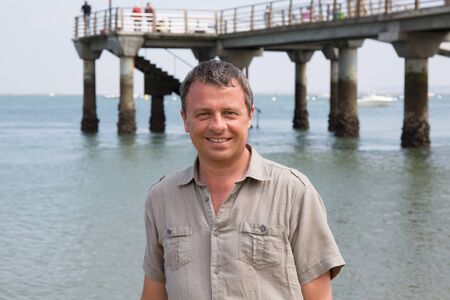 Charming man at the beach on holidaysの写真素材