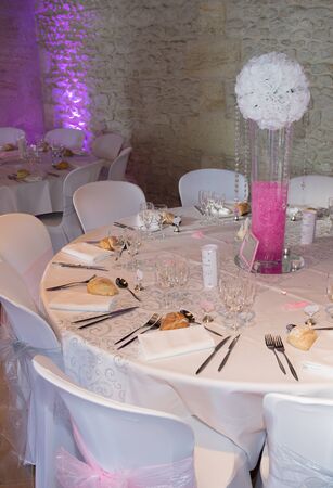 Banquet wedding table setting on evening receptionの写真素材
