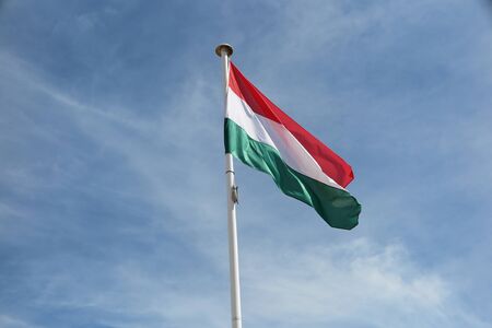 Hungarian  flag against blue skyの写真素材