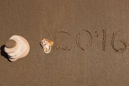 Year 2016 on the beach for background