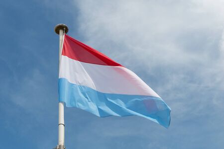 Flag of paraguay under blue sky