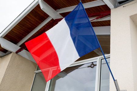 French flag under a very blue skyの写真素材