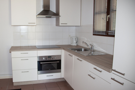 The modern fitted clean kitchen in home.の写真素材