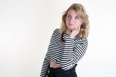 Blond young and sexy woman posing for the camera isolated under white backgroundの写真素材