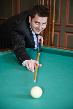 Charming groom outside happy looking at the cameraの写真素材