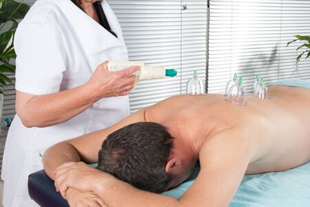 Alternative massage , a male having a chinese therapy to cure