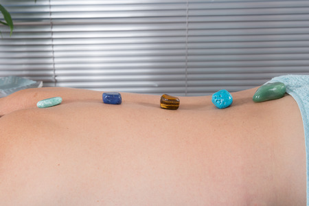 Man having stone massage in a spa salon