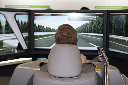 Man in an electric car simulator -の写真素材