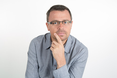 Handsome man with glasses, unhaven with a blue casual shirt