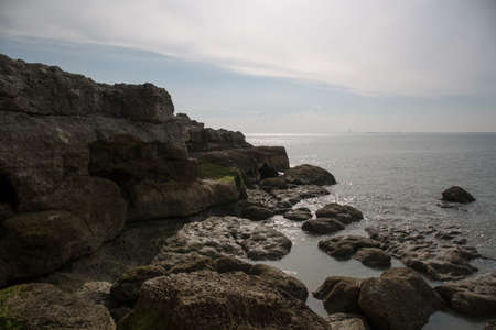 Rocks , sea and blue skyの写真素材