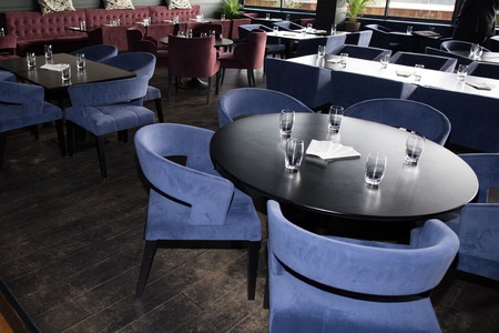 Interior of a restaurant, modern design in few colors, blue, red,