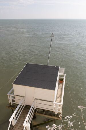 Fishing cabin in the estuary. West coast of Franceの写真素材