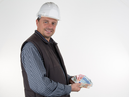 Inspector with helmet and moneyの写真素材