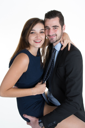 Beautiful sexy lady seducing young businessman isolated on white.の写真素材