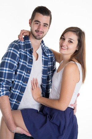 Portrait of a beautiful young happy smiling couple - isolatedの写真素材