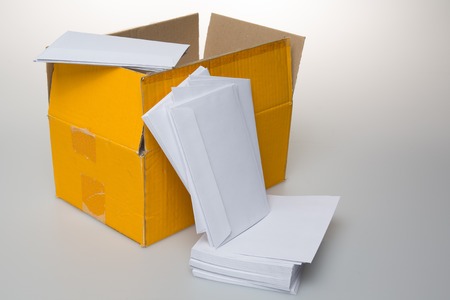 Photo of packaging with envelopes items isolated on a white background.