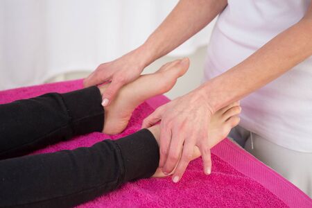 Picture of specialist doing reiki treatment to young womanの写真素材