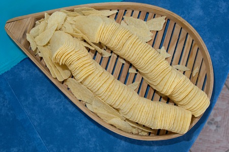 salt biscuit isolated on a blue and brown backgroundの写真素材
