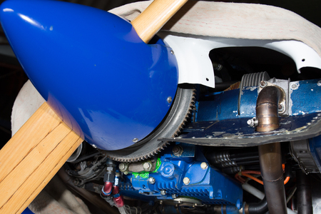 Close-up of a blue aircraft propeller and engine