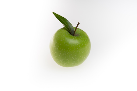 Green apple with leaf isolated on a white backgroundの写真素材