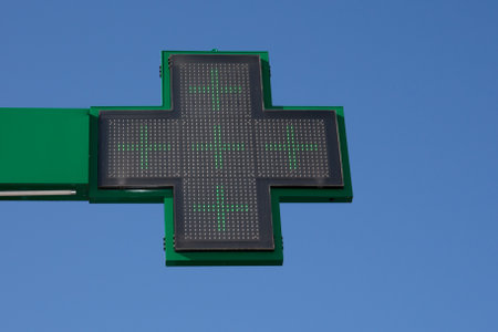 Green cross indicating the location of a pharmacyのeditorial素材