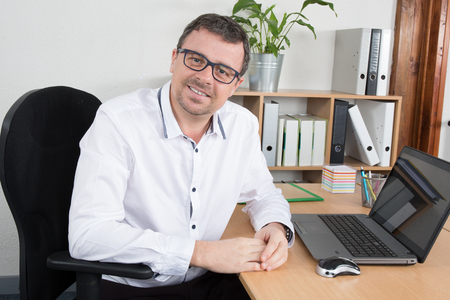Portrait of a nice smiling brown hair man with beard and glasses,の写真素材