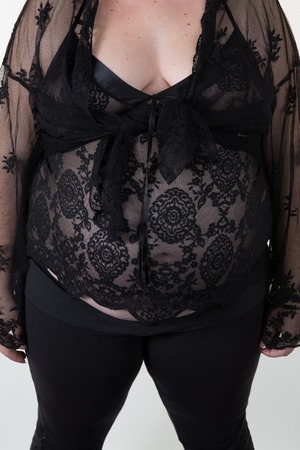 Overweight body of a woman wearing clothesの写真素材