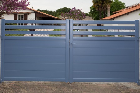 Blue Gates. New family house with blue automatic gatesの写真素材