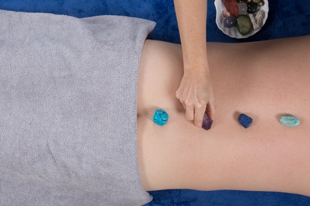 Alternative medicine, therapist using gemstones for lithotherapyの写真素材