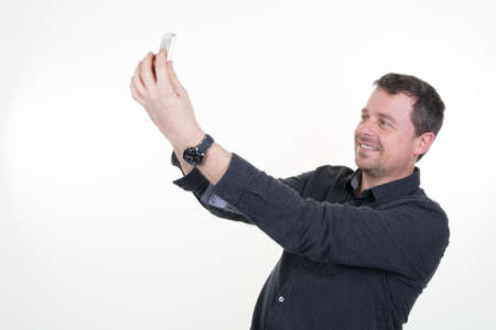 Caucasian man take a selfie isolated on whiteの写真素材