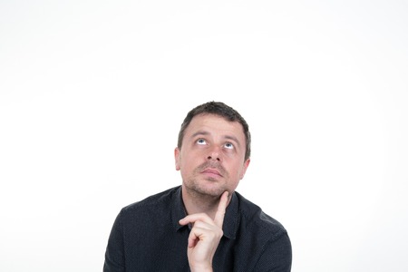 Portrait of mid aged  man looking up - isolated on white.の写真素材