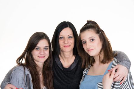 Mother and teenage daughter together. Happy family. Isolated on white background